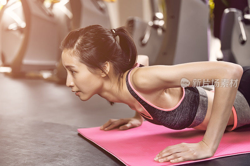 Cute girls working out in a gym